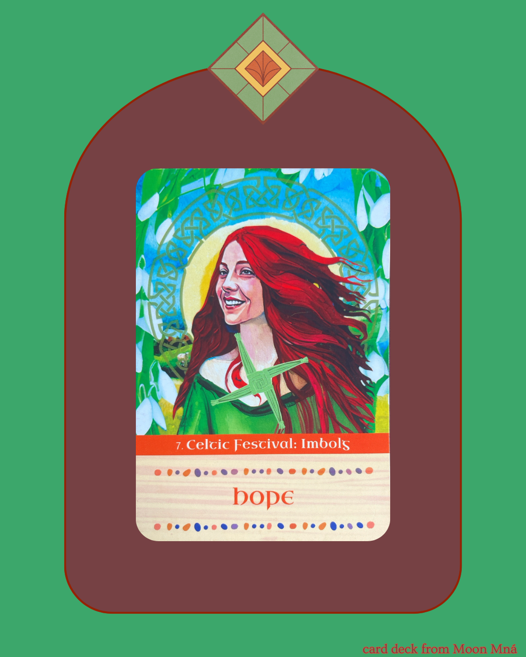Brigid is a young red haired woman surrounded by snowdrop flowers with a woved Brigid's cross on top of her.